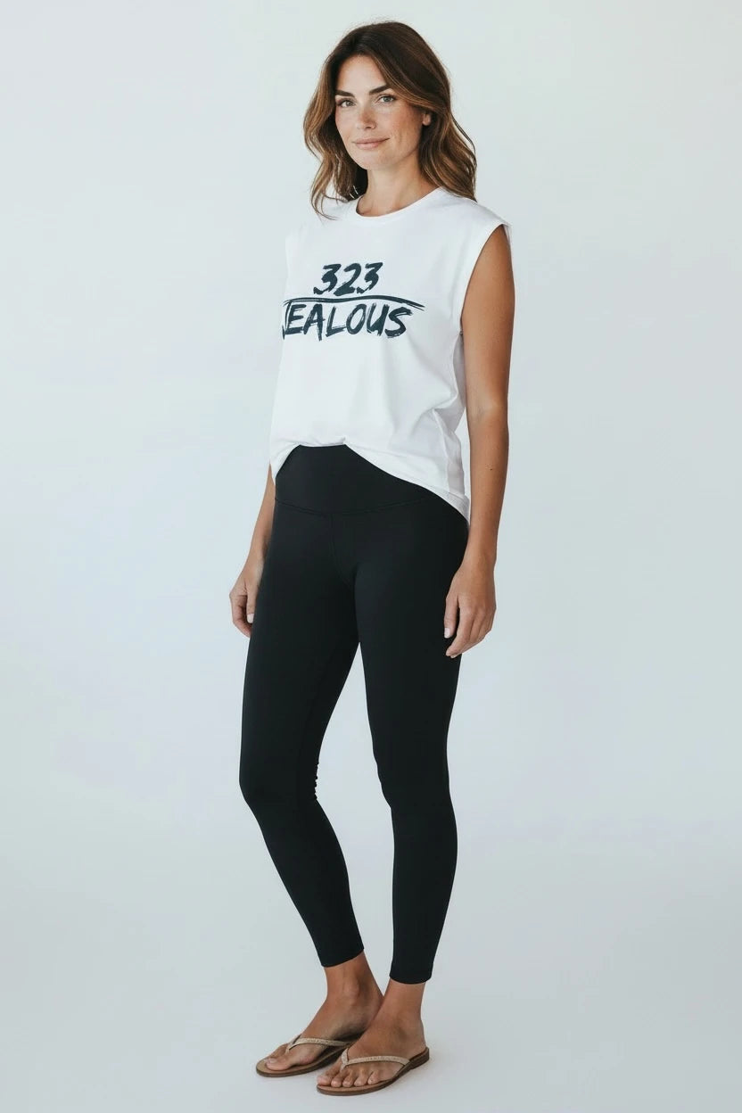Model wearing Jealous Tee Hollywood area code 323 with black leggings