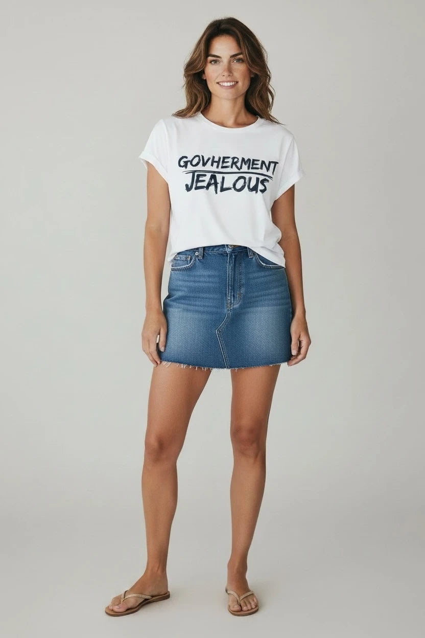 Woman wearing GOVHERMENT JEALOUS progressive muscle tee and jean skirt