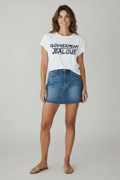 Woman wearing GOVHERMENT JEALOUS progressive muscle tee and jean skirt
