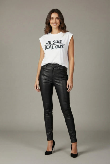 Woman wearing Jealous Tee JE SUIS white progressive women's empowerment tee and black leather pants 