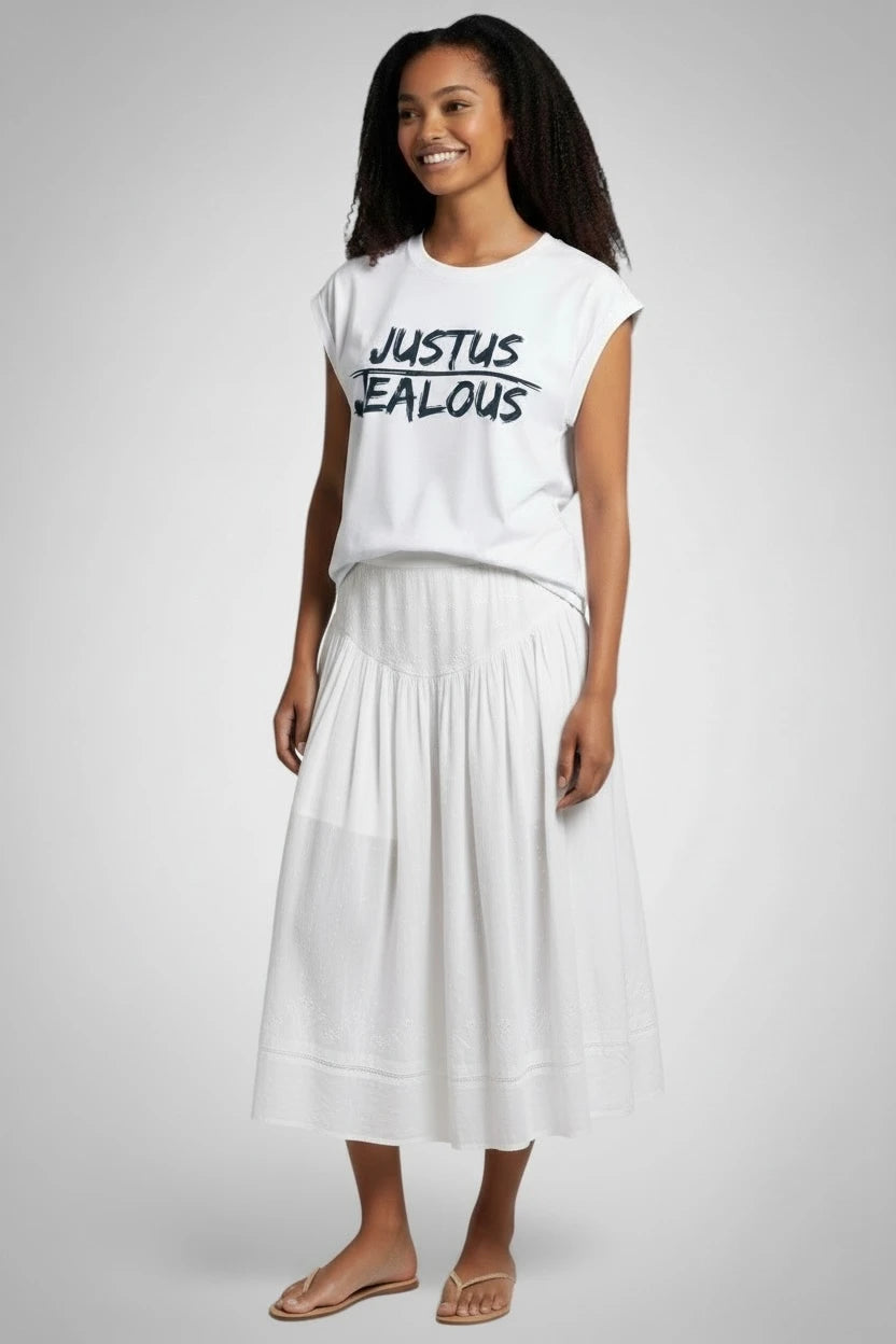 Woman wearing JUSTUS JEALOUS progressive social justice muscle tee and white skirt