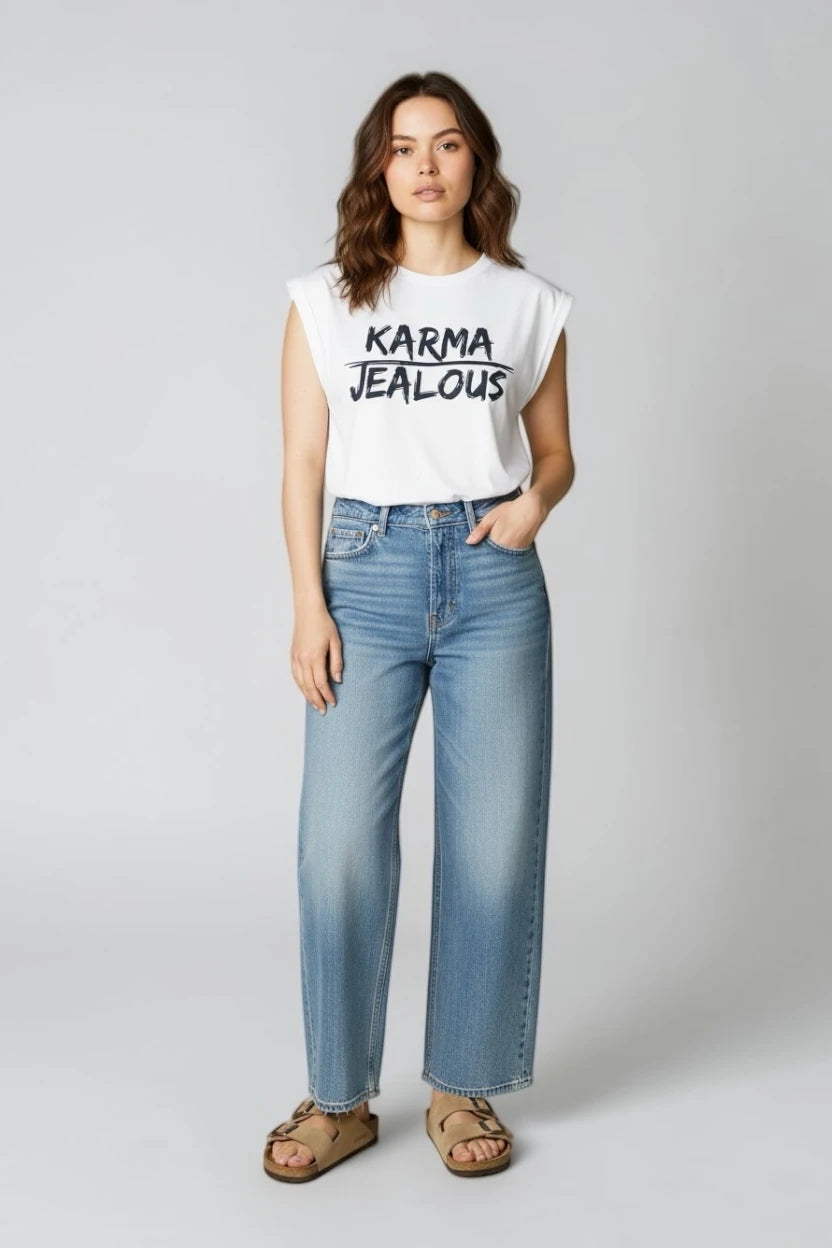 Jealous Tee KARMA feminist empowerment muscle tee worn with denim jeans