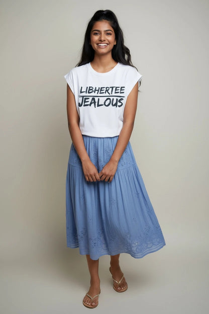 Woman wearing LIBHERTEE JEALOUS progressive muscle tee and skirt