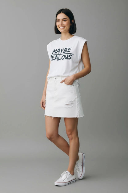 Model wearing white muscle t-shirt with MAYBE JEALOUS graphic and white jean skirt