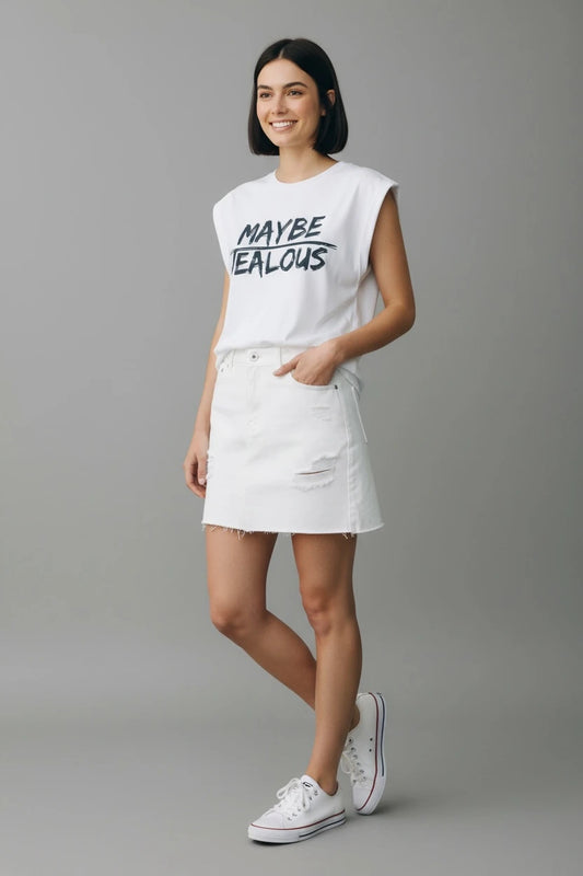 Model wearing white muscle t-shirt with MAYBE JEALOUS graphic and white jean skirt