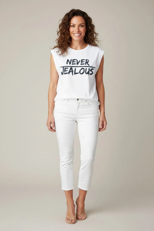 Model wearing Jealous Tee NEVER JEALOUS empowerment tee with white jeans