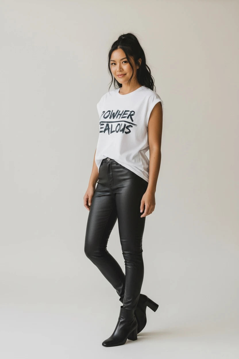 Model wearing Jealous Tee feminist empowerment muscle tee with POWHER JEALOUS design with black leather pants