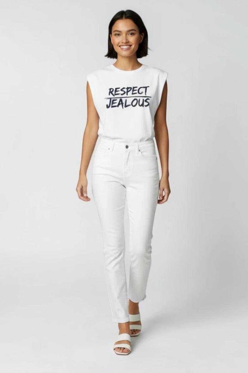 Woman wearing a white tank top with RESPECT JEALOUS design and white pants 