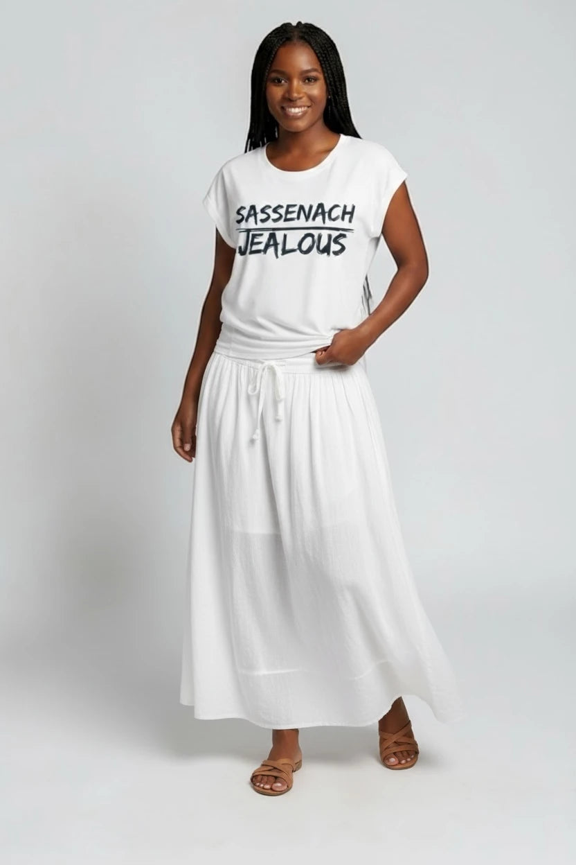 Woman wearing SASSENACH JEALOUS progressive muscle tee and white skirt