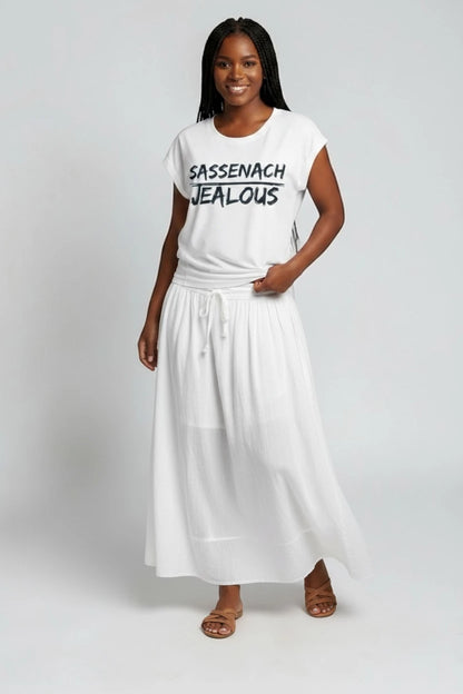 Woman wearing SASSENACH JEALOUS progressive muscle tee and white skirt