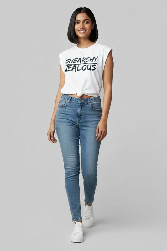 Person wearing social justice muscle tee by JealousTee with SHEARCHY JEALOUS design and jeans