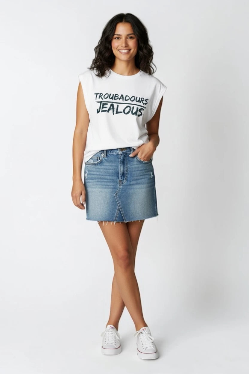 Woman wearing TROUBADOURS JEALOUS progressive muscle tee and jean skirt