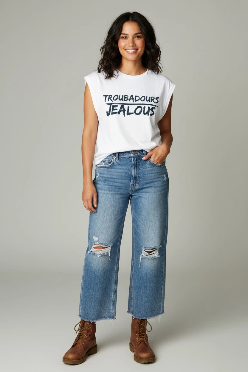 Model wearing Jealous Tee empowerment muscle tee with TROUBADOURS JEALOUS graphic by JealousTee