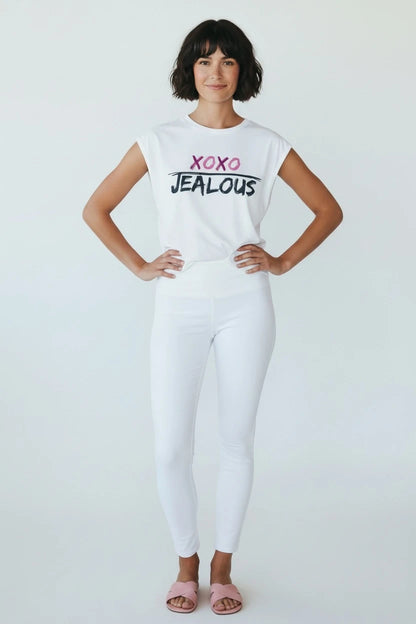 Woman wearing XOXO JEALOUS valentine muscle tee and white jeans